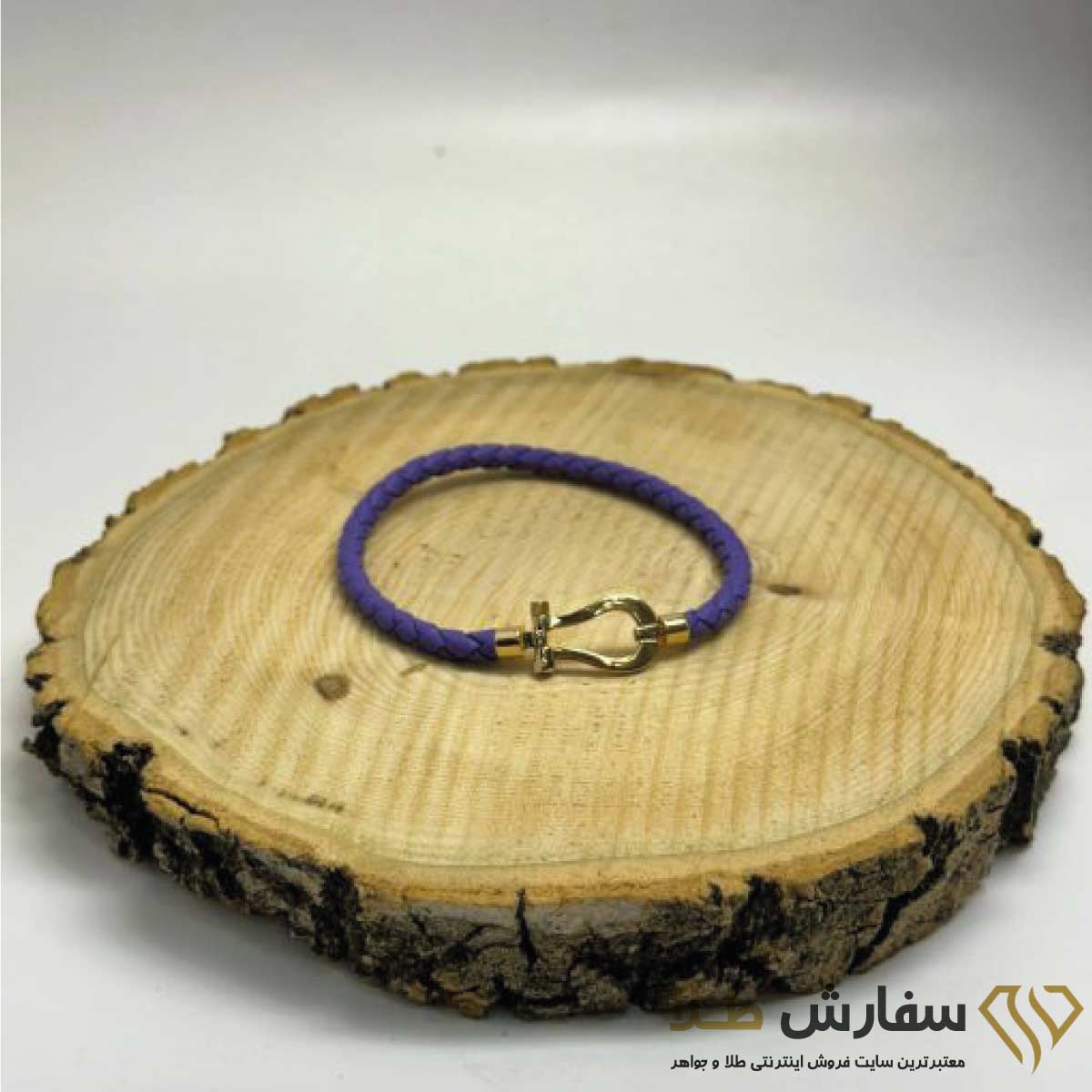 دستبند طلا امگا فرد با بند چرم بنفش ST2713 دستبند طلا امگا فرد با بند چرم رنگی ST2713 - Image 1