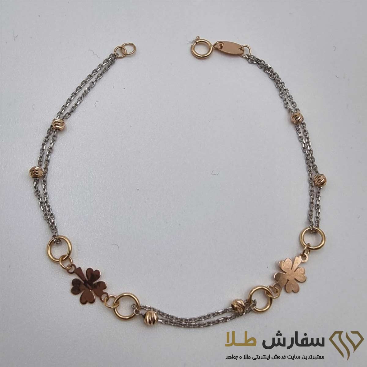 دستبند طلا زنانه طرح گل چهار برگ ST4828 دستبند طلا زنانه طرح گل چهار برگ ST4828 - Image 1
